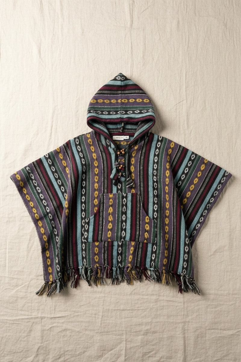 Kids Enchanted Forest Poncho flat lay on linen