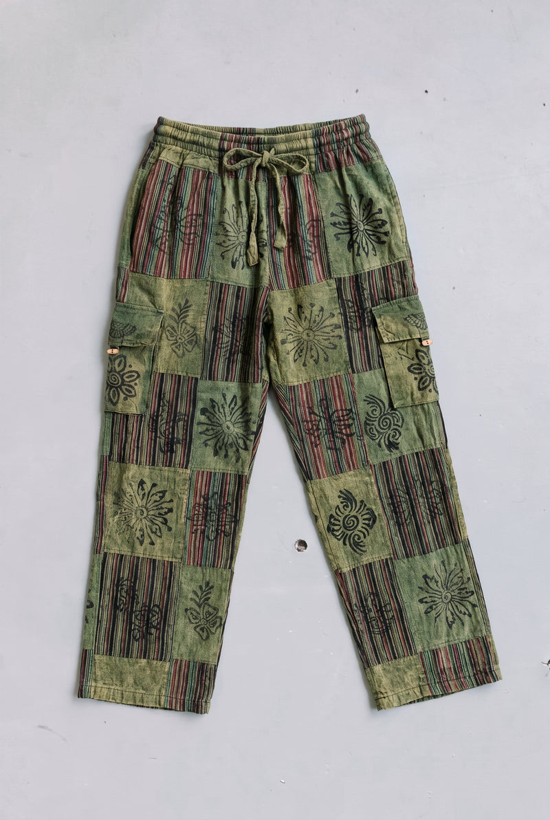 The Mossline Patchwork Pants laid flat, full front view