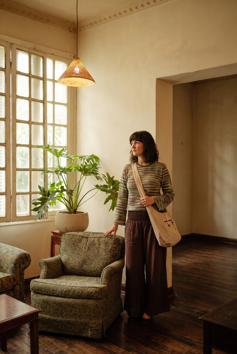 The Nomad Hemp Sling Bag cross-body, full outfit look.