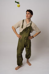 Handmade green dungarees worn on model showing full length