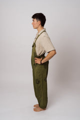 Handmade green Nepalese overalls side view on model