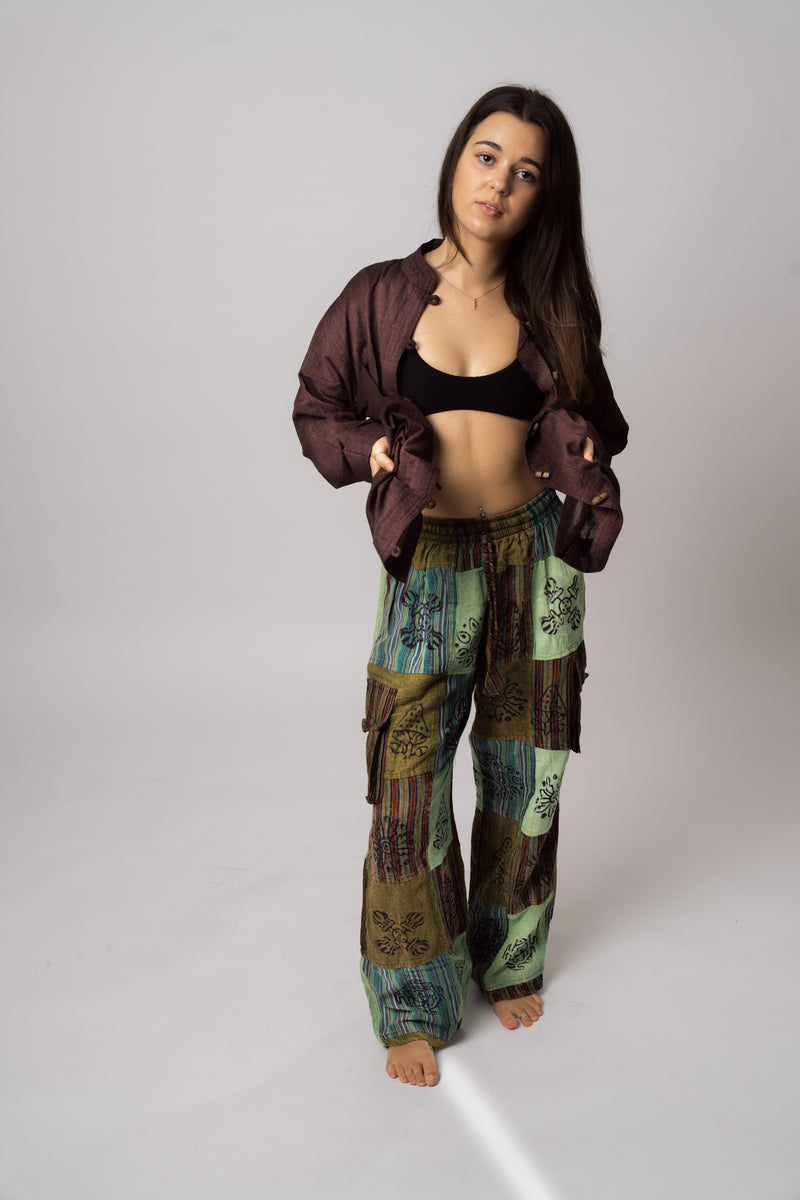 Green patchwork pants worn full length styled with jacket