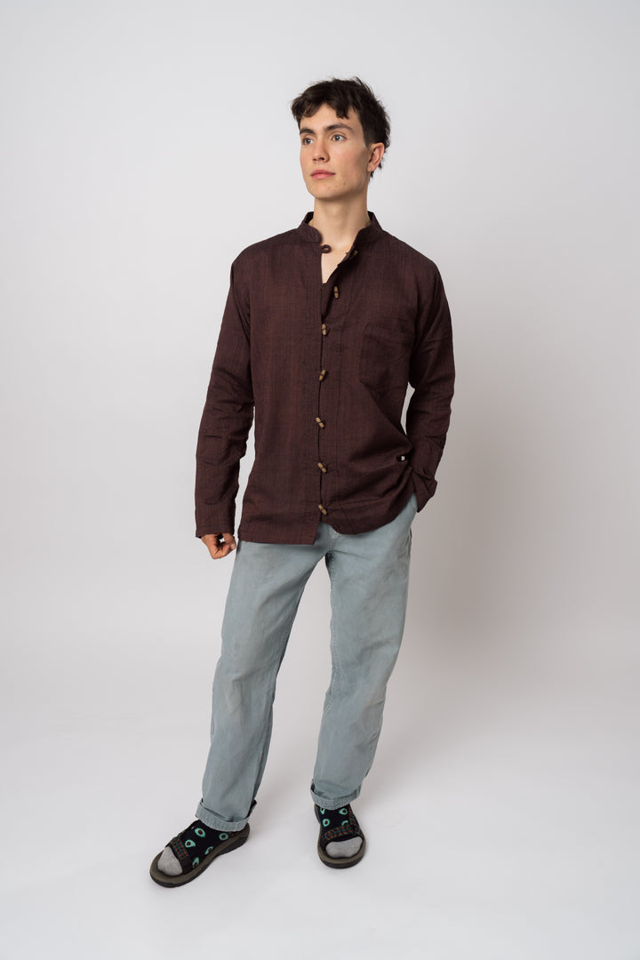 Oak Button-up Shirt in burgundy with wooden buttons and textured weave, shown on a model.
