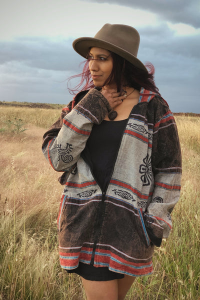 Earthy Jacket in cream, rust and brown patchwork with black geometric tribal pattern details.