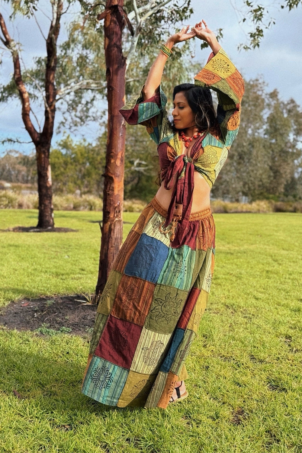 Wrap crop top and patchwork skirt in color blocks: yellow, green, burgundy, blue and cream with floral prints.
