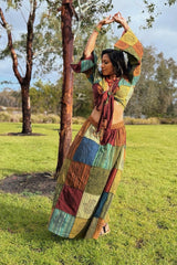 Wrap crop top and patchwork skirt in color blocks: yellow, green, burgundy, blue and cream with floral prints.