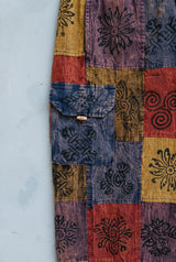 Close-up detail of the Emberglow Patchwork Pants, block print and stitching
