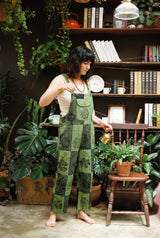 Ana wearing the Fernbrook Overalls in Forest, plant room