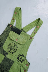 Close-up detail of the Fernbrook Overalls in Forest, block print and stitching