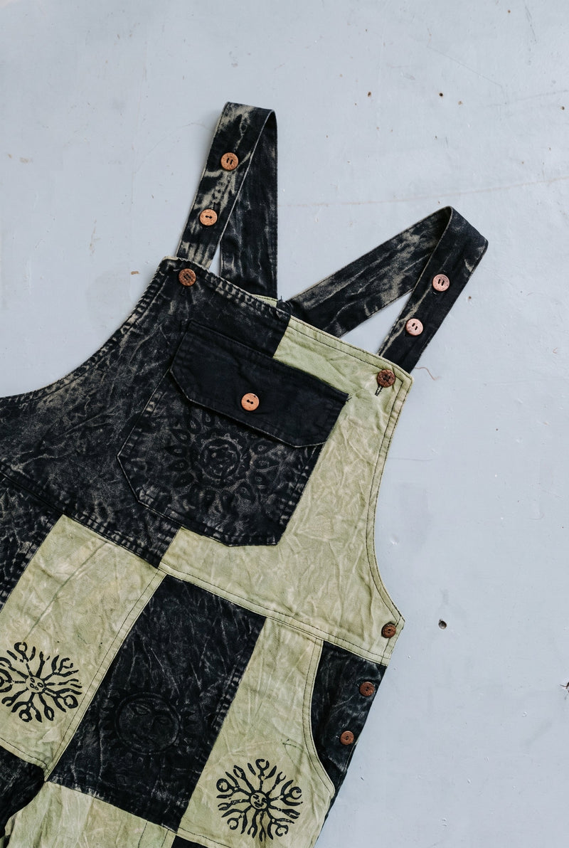 Close-up detail of the Mosslight Overalls, block print and stitching