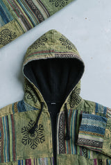 Close-up detail of the Green Horizon Patchwork Jacket, block print and stitching