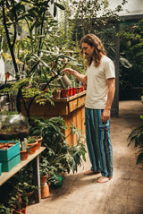 Riverstone Gheri Cargo Pants on a male model, vertical gheri stripe with flap patch pocket and elastic waist.