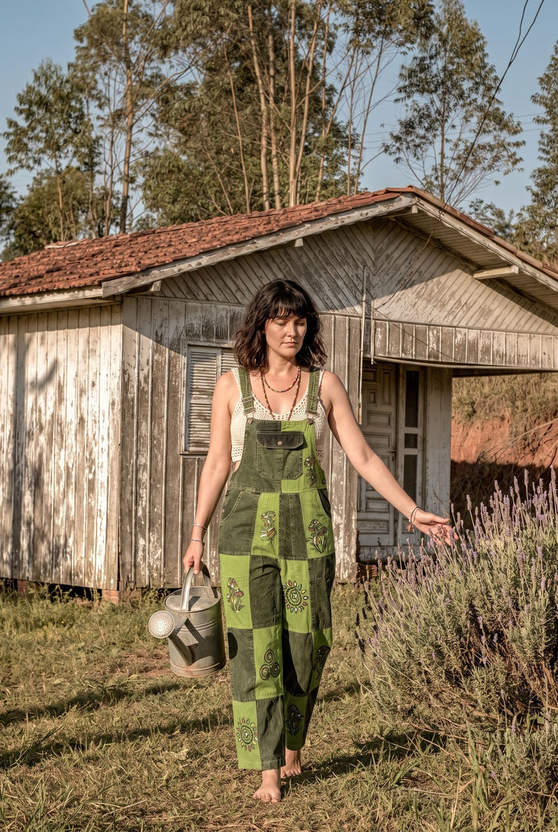 Sungrove Overalls outdoors at golden hour, full length, mushroom and sunburst patches sharp.