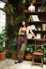 Duskwood Overalls front-on, aubergine, olive, rust and brown patchwork with mandala and floral prints.