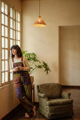Duskwood Overalls front-on, aubergine and olive patchwork with a printed bib chest pocket.