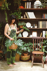 Sungrove Overalls at a three-quarter angle with a basket, bib pocket and sunburst leg panel in view.