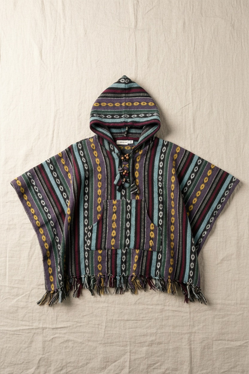 Kids Enchanted Forest Poncho flat lay on linen