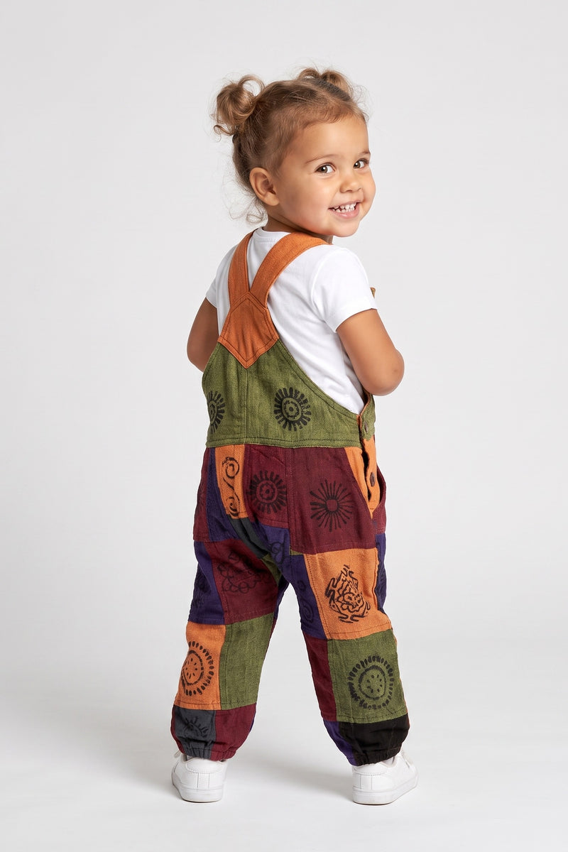 Kids Patchwork Dungarees — back view with crossed straps