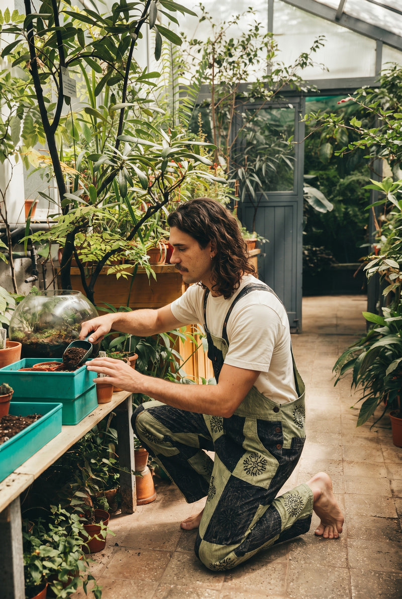 Reed wearing the Mosslight Overalls, plant room