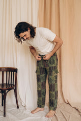 Reed wearing the Mossline Patchwork Pants, studio