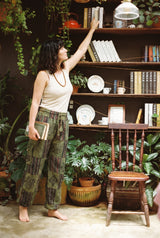 Ana wearing the Mossline Patchwork Pants, plant room
