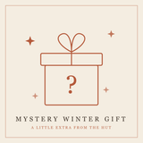 Rust-colored outlined gift box with heart-shaped bow and question mark, surrounded by decorative stars on cream background.