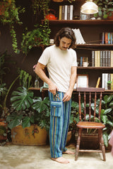 Close view of the deep flapped cargo pocket on the Riverstone Gheri Cargo Pants in blue woven stripe