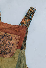 Close-up detail of the Wattlewood Overalls, block print and stitching