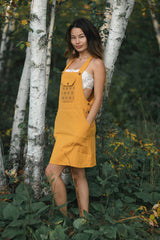 Sunflower Dress in golden yellow with geometric chest pattern, sleeveless with wide straps, knee-length with pockets.